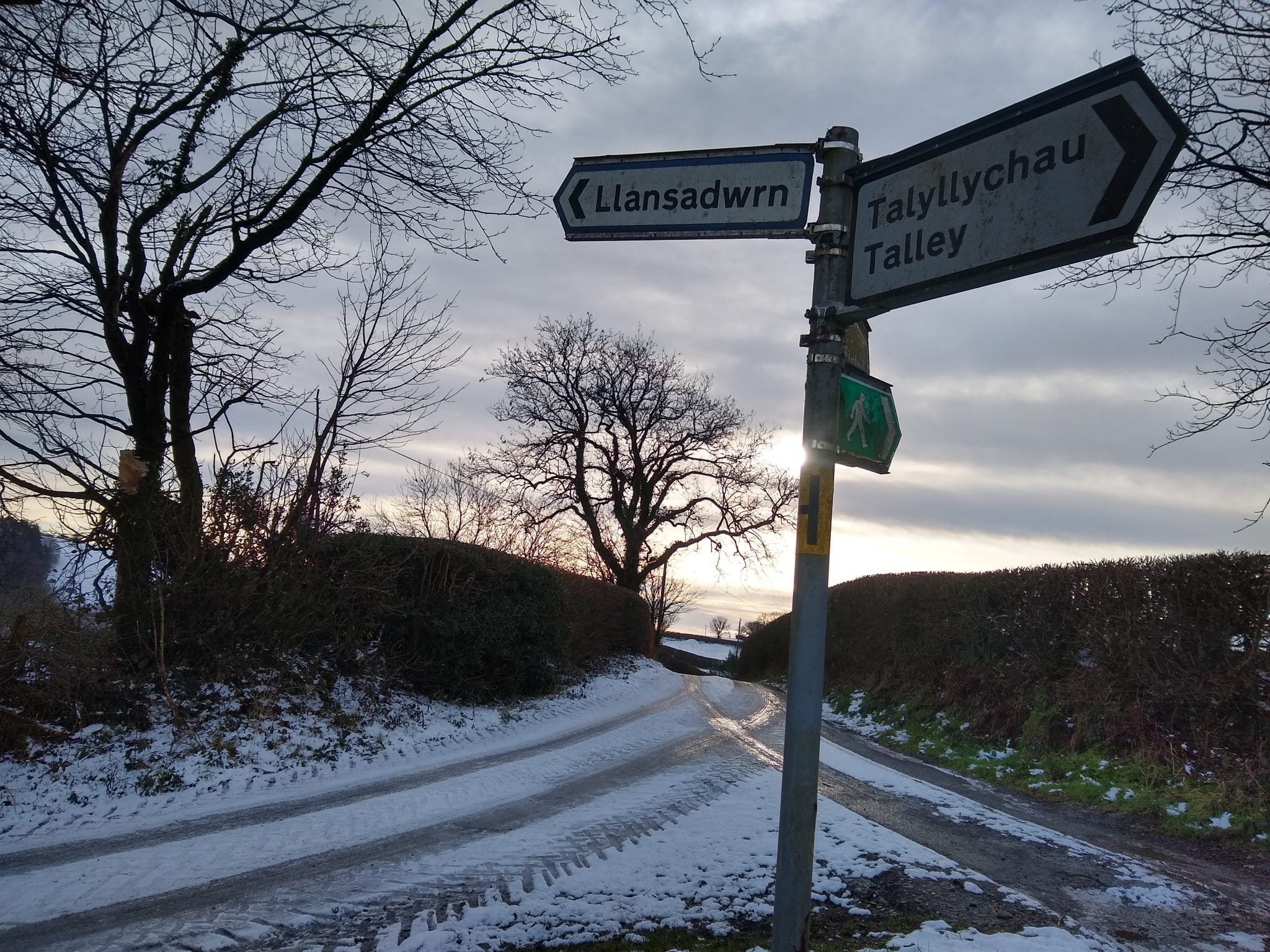Llansadwrn/ Talley village sign in the snow